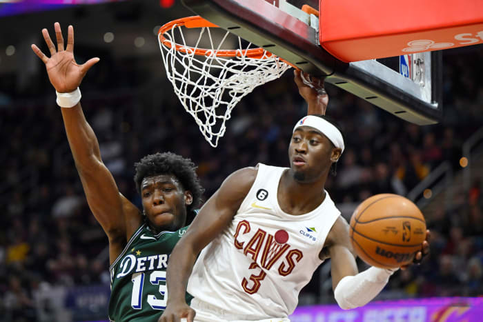 Mar 4, 2023; Cleveland, Ohio, USA; Cleveland Cavaliers guard Caris LeVert (3) passes beside Detroit Pistons guard James Wiseman (13) in the third quarter at Rocket Mortgage FieldHouse. Mandatory Credit: David Richard-USA TODAY Sports